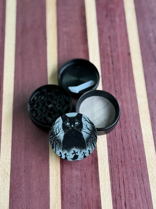 Cats and witches grinder